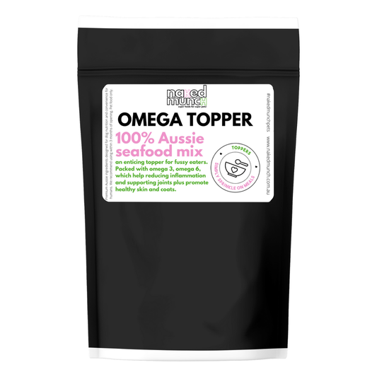 A package of 'Omega Topper' which is a 100% Australian seafood mix, presented in a black resealable pouch with the brand 'Naked Munch' and product details.